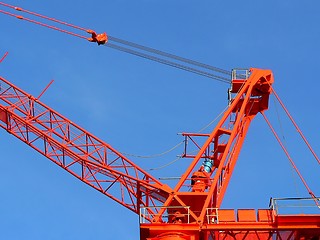 Image showing Red crane over blue sky