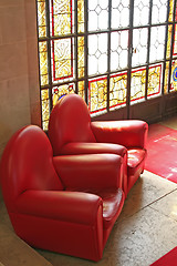 Image showing Sofas in waiting area with stained glass window