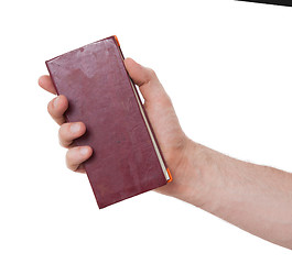 Image showing Old diaries in a hand