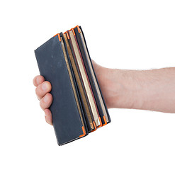 Image showing Old diaries in a hand