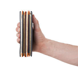 Image showing Old diaries in a hand