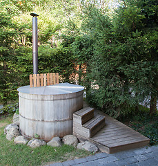 Image showing Wooden hot tub in the alps