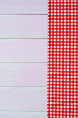 Image showing White and red towel over wooden table