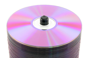 Image showing Close-up of purple DVDs on spindle