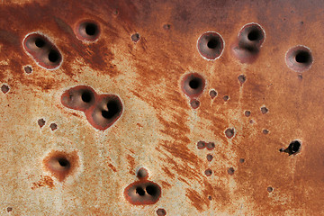 Image showing rusting bullet holes background