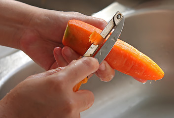 Image showing Peeling carrot