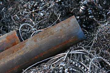 Image showing steel pipes on shavings