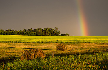 Image showing Storm Clouds Prairie Sky Rainbow