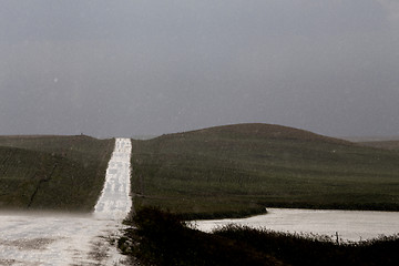 Image showing Storm Clouds Prairie Sky Wet Road