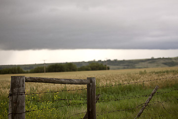 Image showing Storm Clouds Prairie Sky Fence