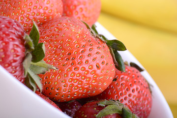 Image showing strawberries and bananas close up, health food concept