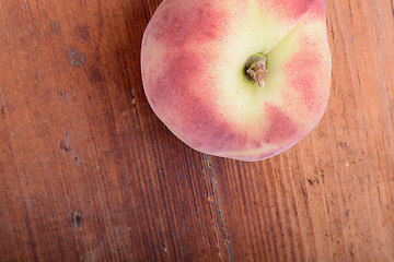 Image showing peach set on the wooden background