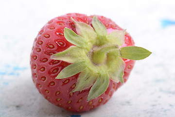 Image showing big fresh strawberry with green leave, close up