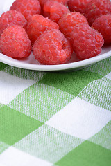 Image showing fresh raspberries on the white plate