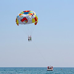 Image showing Parasailing in a blue sky.