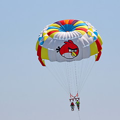 Image showing Parasailing in a blue sky.