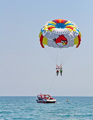 Image showing Parasailing in a blue sky.