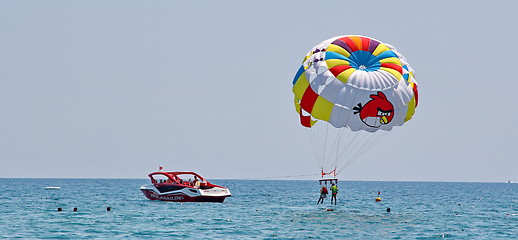 Image showing Parasailing in a blue sky.