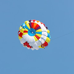 Image showing Parasailing in a blue sky.