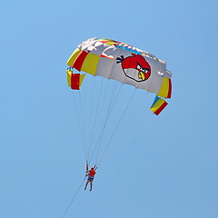 Image showing Parasailing in a blue sky.