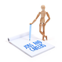 Image showing Wooden mannequin writing - Jobs and careers