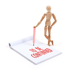 Image showing Wooden mannequin writing - To be continued