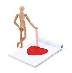 Image showing Wooden mannequin writing - Heart