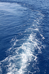 Image showing Blue sea water with trace of the boat 