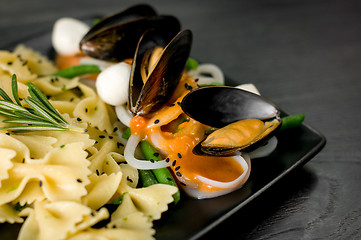 Image showing Delicious portion of Farfalle with seafood and mozzarella