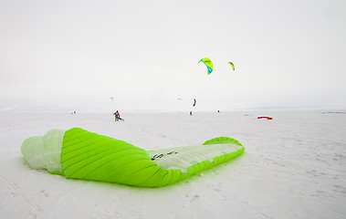 Image showing Kiteboarder with kite on the snow