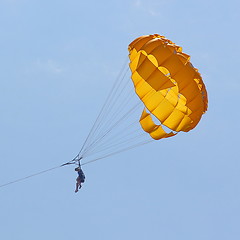 Image showing Parasailing in a blue sky