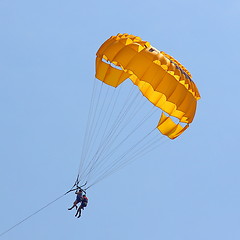 Image showing Parasailing in a blue sky