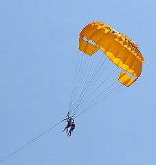 Image showing Parasailing in a blue sky