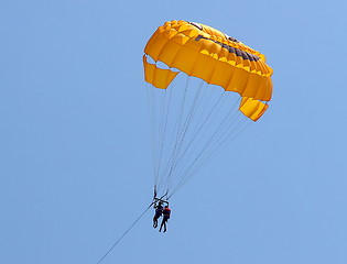 Image showing Parasailing in a blue sky