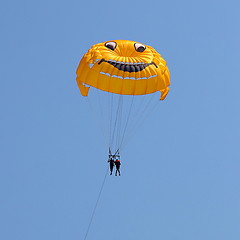 Image showing Parasailing in a blue sky