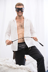 Image showing Handsome guy with whip BDSM in the leather mask