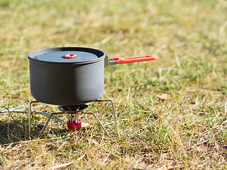 Image showing Can on portable camping stove