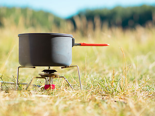 Image showing Can on portable camping stove