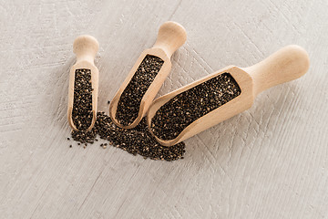 Image showing Chia seeds in wooden scoops