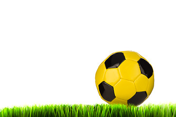 Image showing Yellow football on grass field