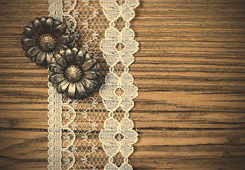 Image showing vintage button and lace tape