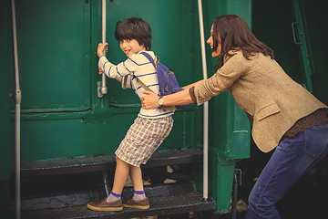 Image showing Boy traveler and mother