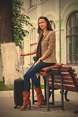 Image showing beautiful adult woman with luggage on the platform