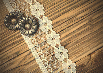 Image showing vintage button and lace tape