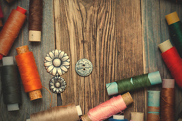 Image showing vintage tools of thread and old buttons