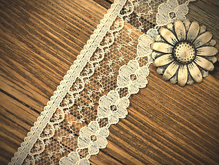 Image showing vintage button and lace tape