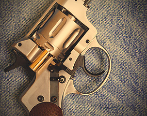 Image showing Nagan revolver with cartridge