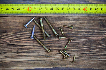 Image showing screw and measuring tape