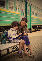 Image showing beautiful woman and boy waiting train