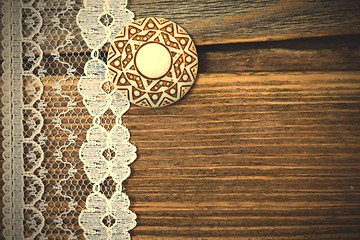 Image showing vintage lace with a brooch